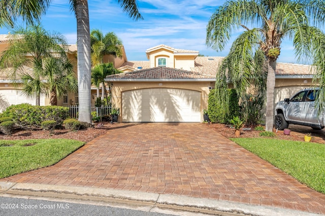 mediterranean / spanish-style house featuring a garage