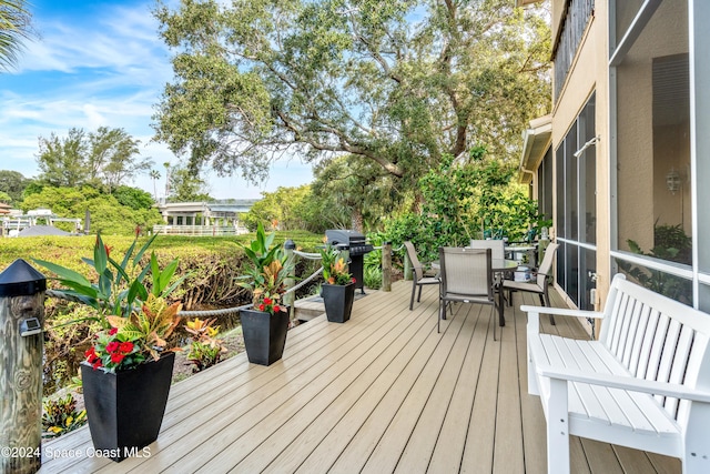 wooden deck with grilling area