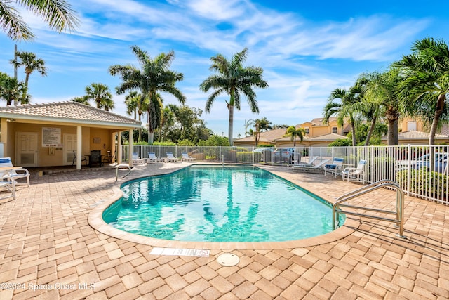 view of swimming pool with a patio area