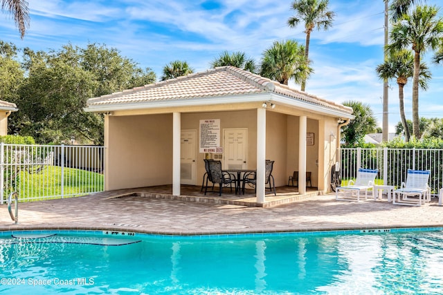 view of swimming pool with a patio