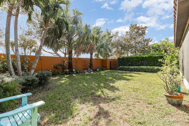view of yard with a fenced backyard