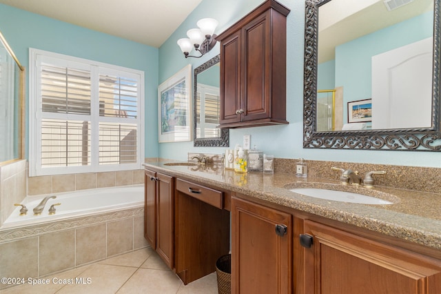 bathroom featuring vanity, tile patterned floors, and plus walk in shower