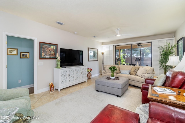 tiled living room with ceiling fan, visible vents, and baseboards