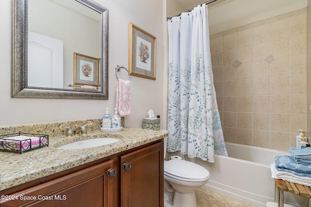 full bathroom featuring vanity, shower / bath combo with shower curtain, toilet, and tile patterned floors