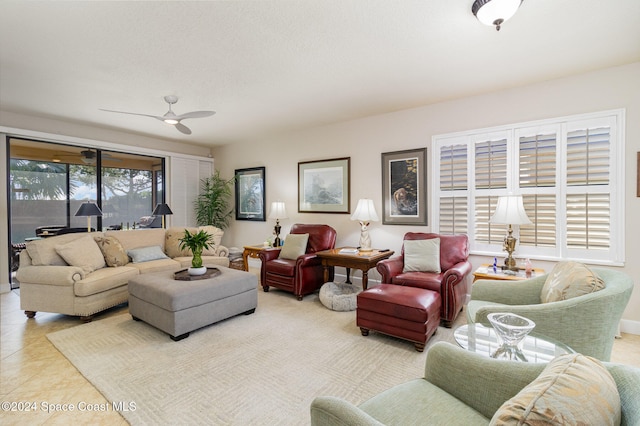 living room with light tile patterned flooring and ceiling fan