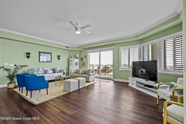 living room with ornamental molding, a textured ceiling, dark hardwood / wood-style floors, and ceiling fan