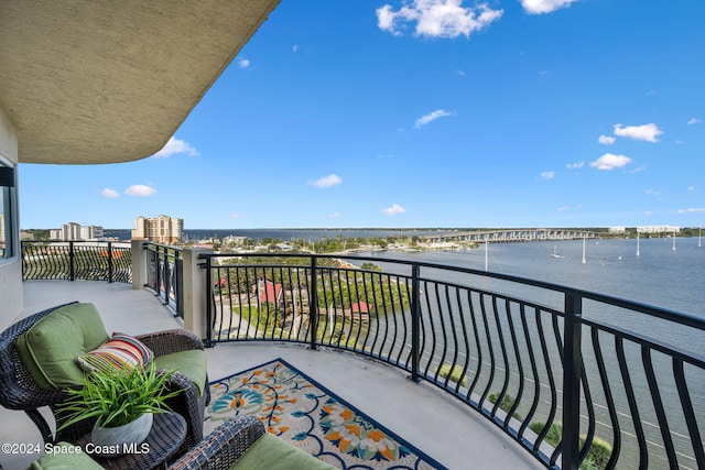 balcony featuring a water view