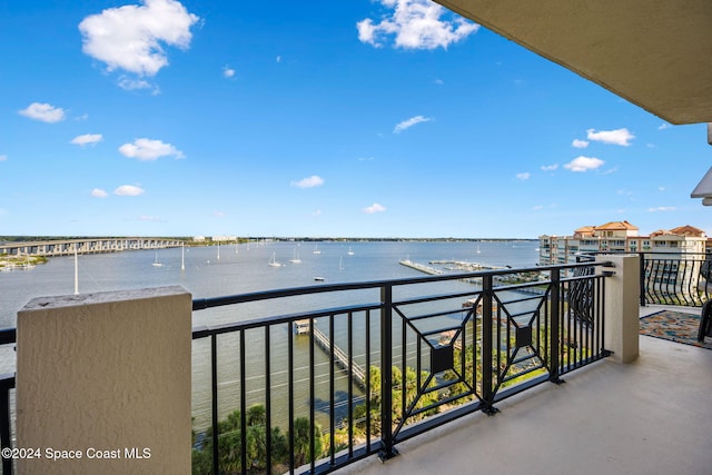 balcony featuring a water view