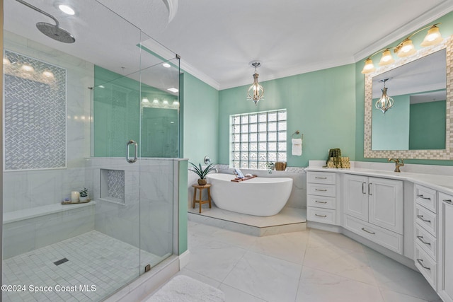 bathroom with vanity, crown molding, and shower with separate bathtub