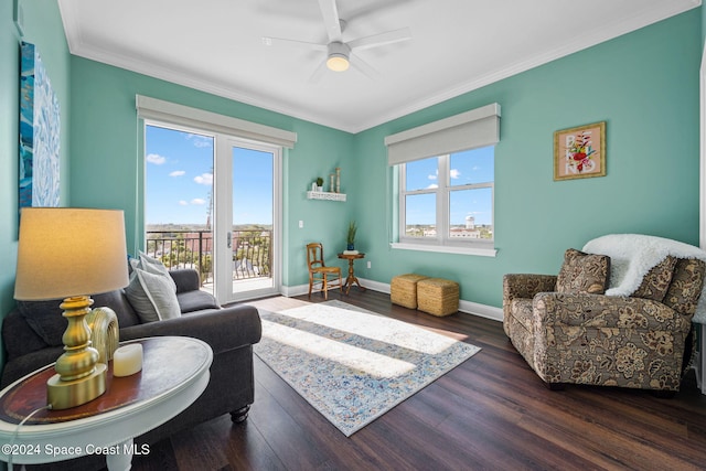 living room featuring crown molding, dark hardwood / wood-style floors, and ceiling fan