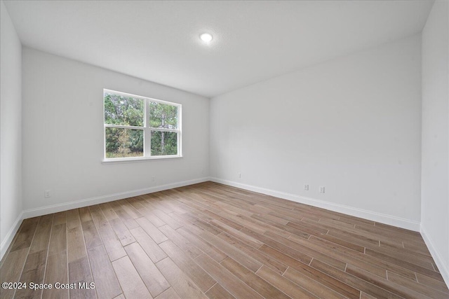 spare room featuring light hardwood / wood-style floors