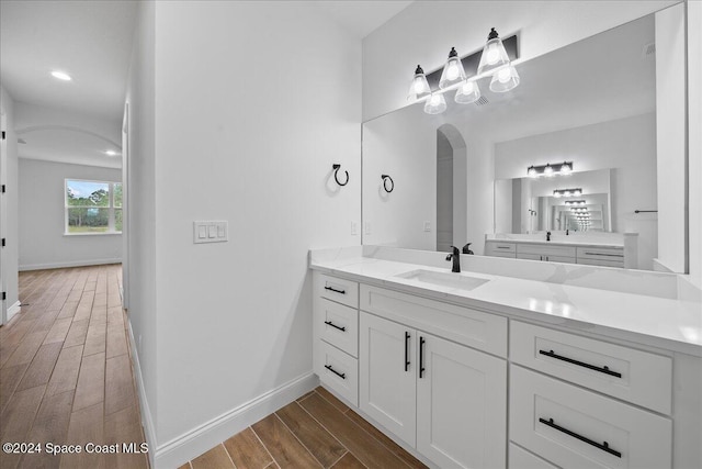 bathroom with vanity and hardwood / wood-style flooring