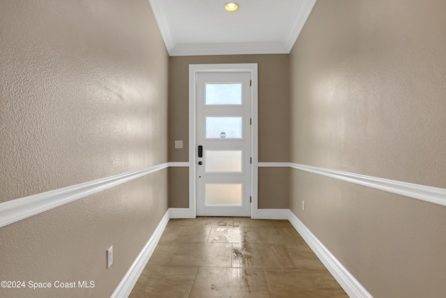 doorway featuring crown molding