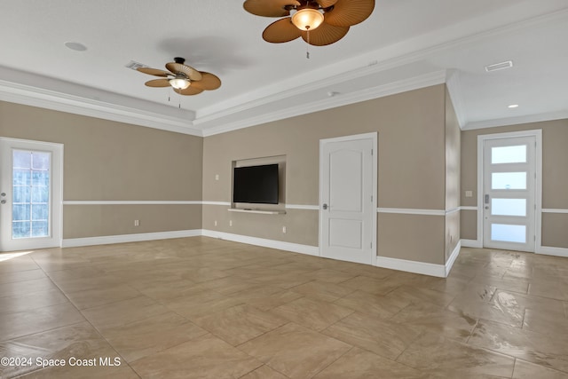 unfurnished living room featuring ceiling fan and crown molding