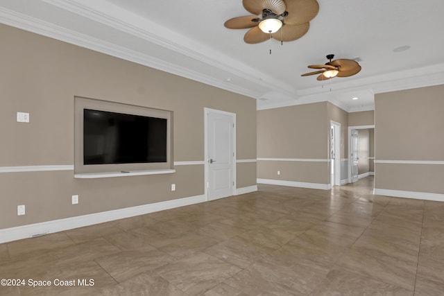 unfurnished living room with crown molding, a ceiling fan, and baseboards