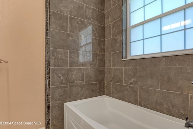 full bath featuring washtub / shower combination