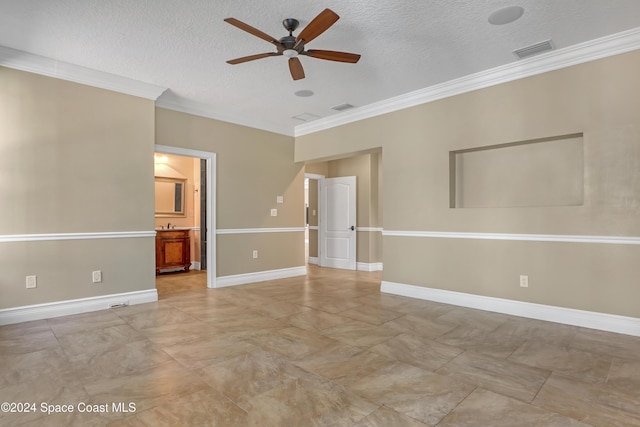 unfurnished room with visible vents, ornamental molding, ceiling fan, and a textured ceiling