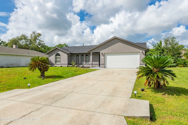 ranch-style home with a front yard and a garage