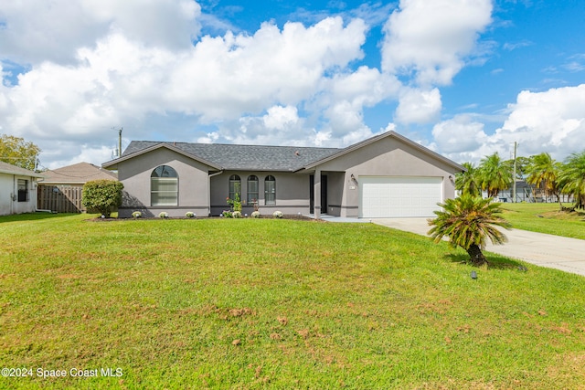 single story home with a front yard and a garage