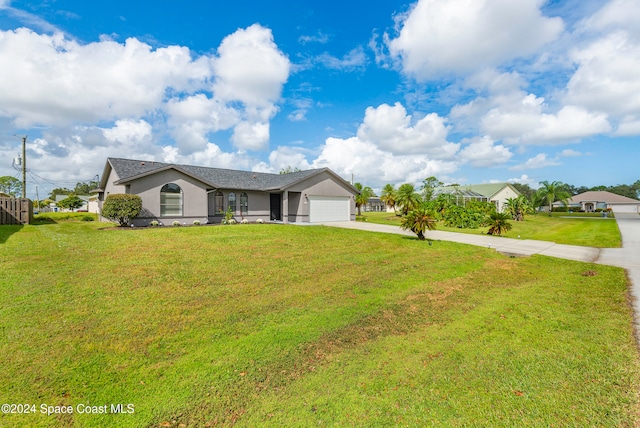 ranch-style house with a front yard and a garage