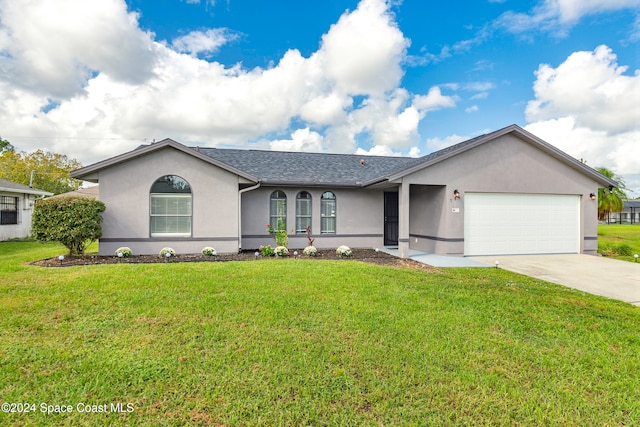 single story home featuring a front yard and a garage