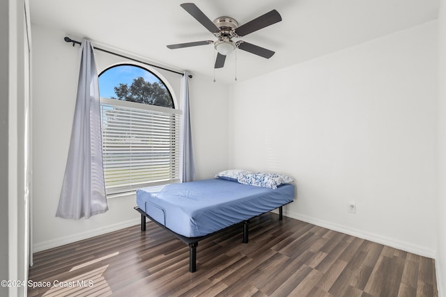 bedroom featuring ceiling fan and dark hardwood / wood-style flooring