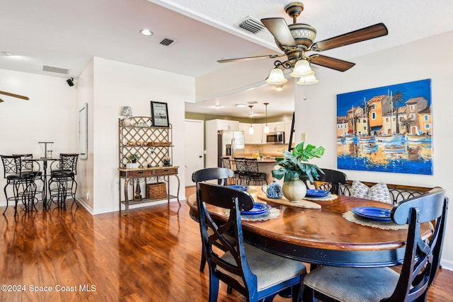 dining room featuring ceiling fan and dark hardwood / wood-style floors