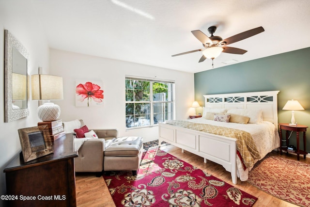 bedroom featuring light wood-type flooring and ceiling fan