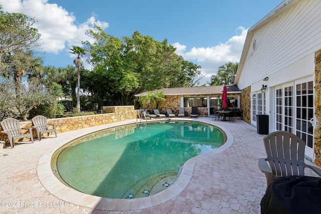 view of pool with a patio area