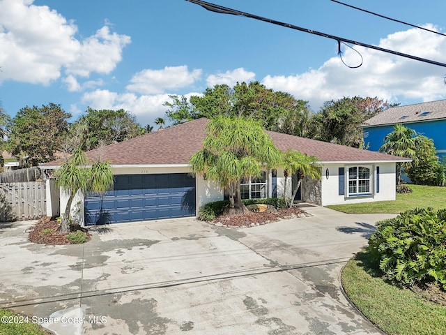 single story home featuring a garage