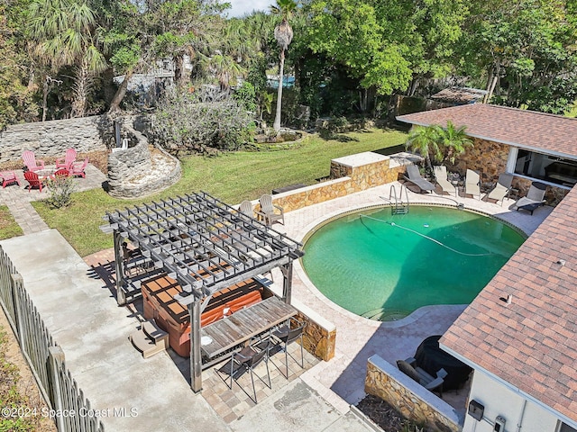 view of pool featuring a yard and a patio area