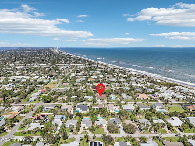 aerial view featuring a water view and a beach view