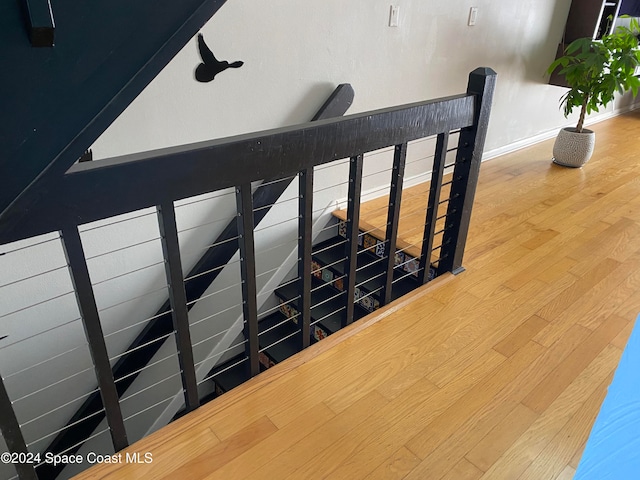 stairway featuring hardwood / wood-style floors