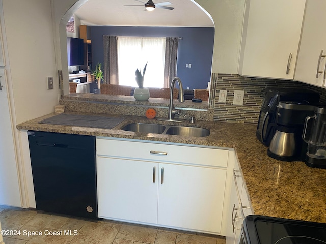 kitchen featuring dishwasher, backsplash, sink, range, and white cabinetry