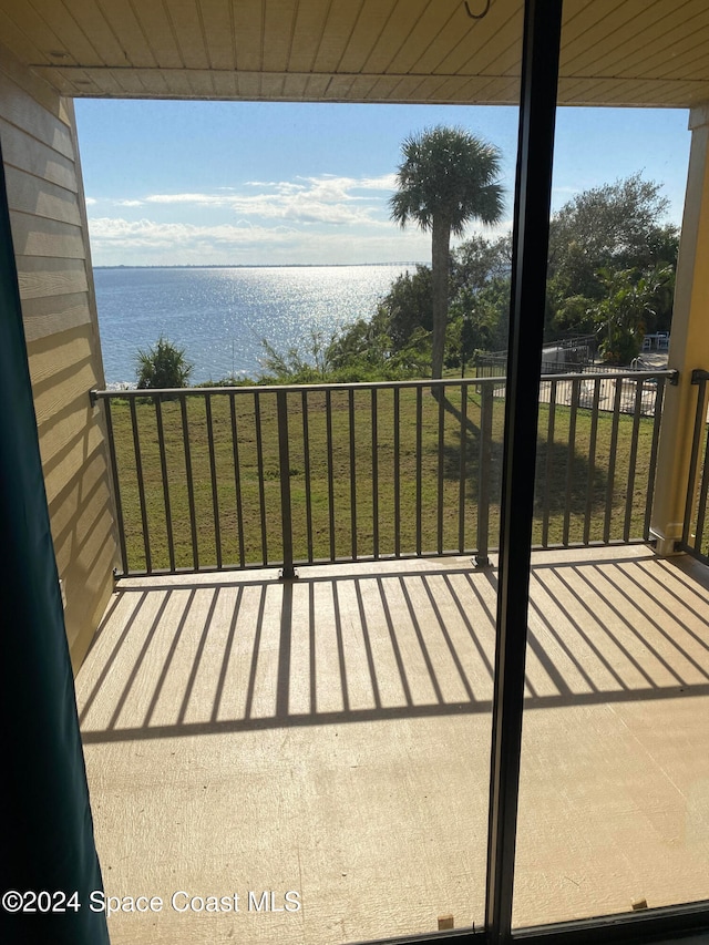 balcony featuring a water view