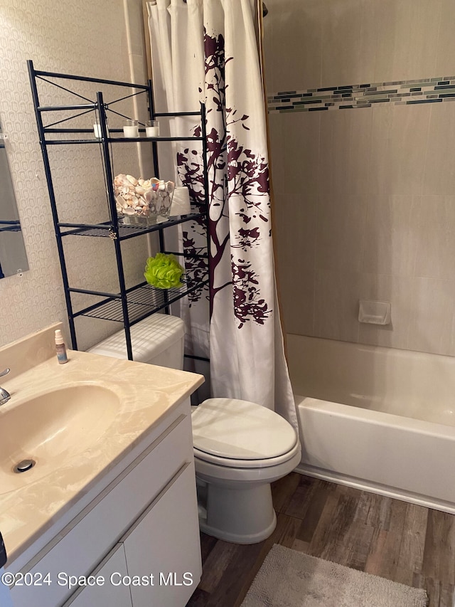 full bathroom featuring vanity, toilet, shower / bath combination with curtain, and hardwood / wood-style floors