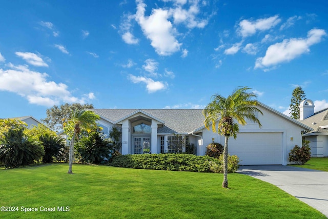 single story home featuring a front yard and a garage