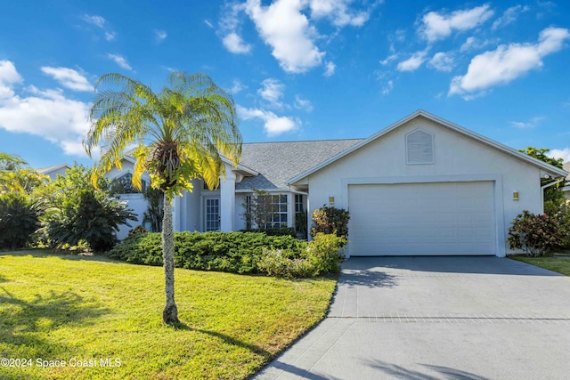 single story home featuring a front yard and a garage