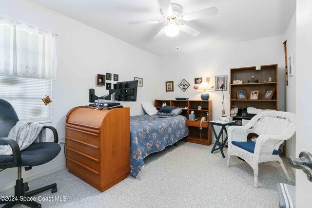 bedroom with multiple windows, carpet floors, and ceiling fan