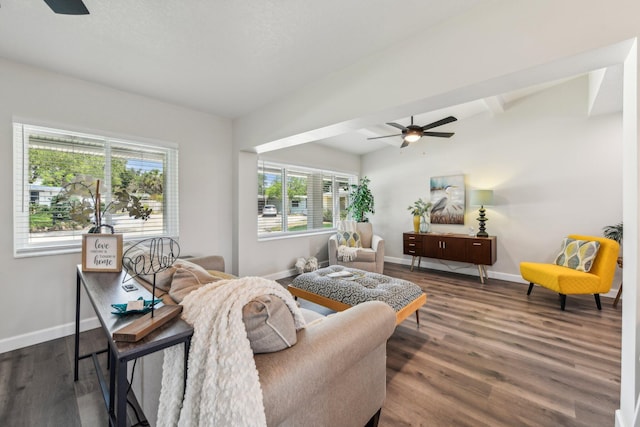 living room featuring hardwood / wood-style floors, lofted ceiling with beams, and ceiling fan