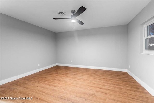 empty room with light hardwood / wood-style floors and ceiling fan