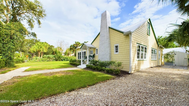 view of home's exterior with a lawn