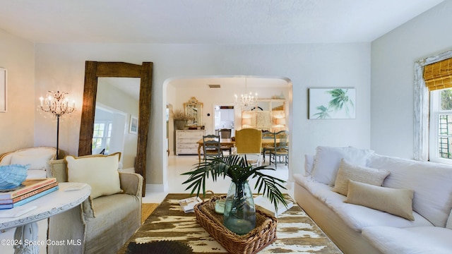 living room with a notable chandelier