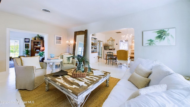 living room featuring a notable chandelier