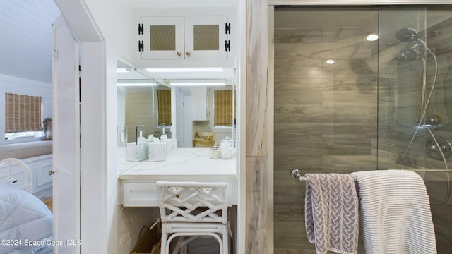 bathroom featuring a shower with door