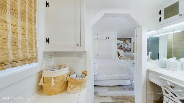 bedroom with hardwood / wood-style flooring