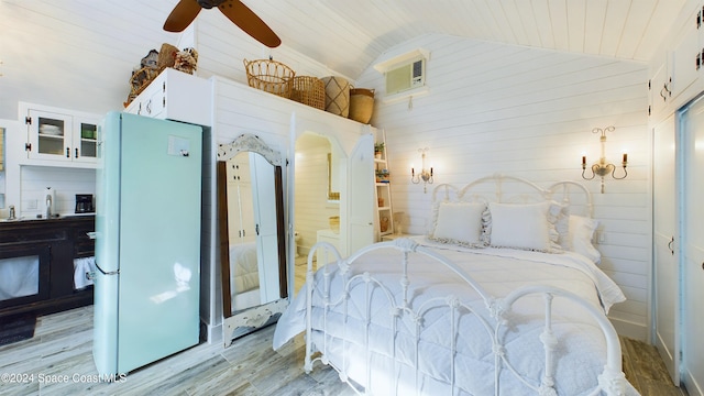 bedroom with light hardwood / wood-style floors, ceiling fan, wood ceiling, and white refrigerator