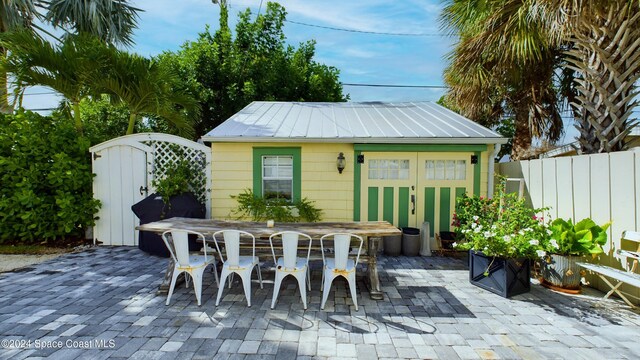 view of patio with a storage shed