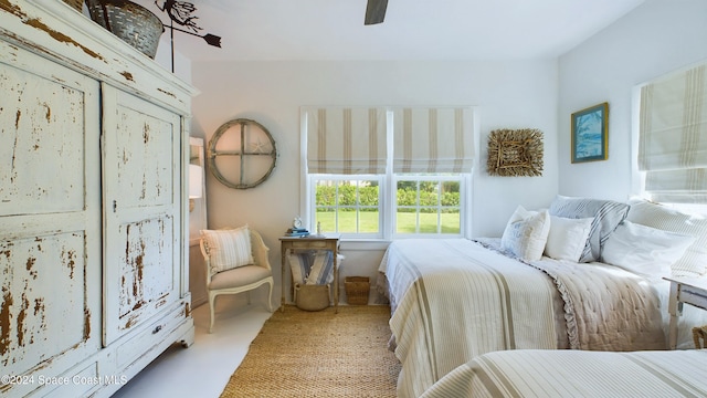 bedroom featuring ceiling fan and light colored carpet