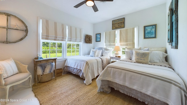 carpeted bedroom featuring ceiling fan